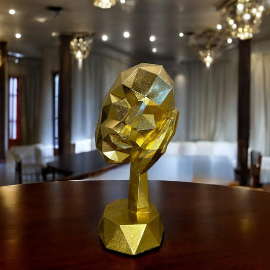 GOLDEN FACE SCULPTURE